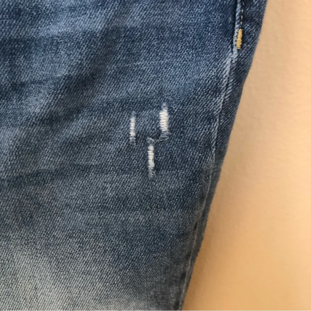 Free people we the free phoenix distressed blown out knees high rise jeans
